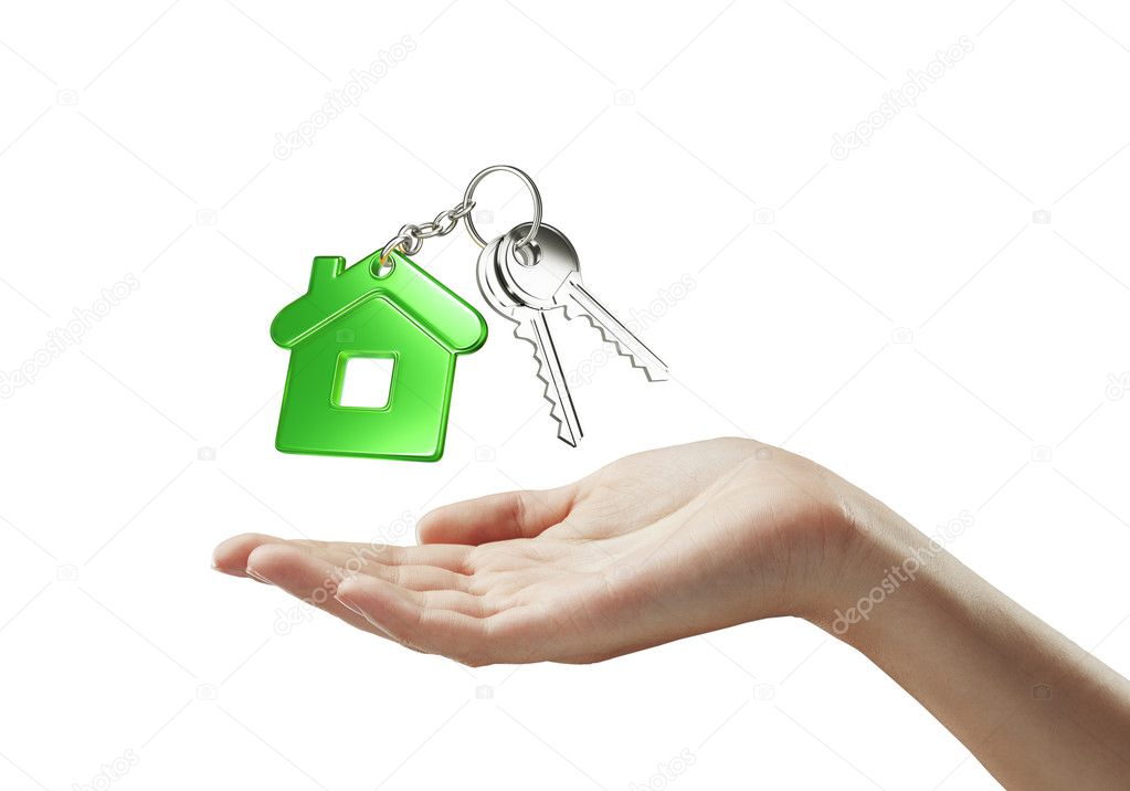 Green key chain with key in hand