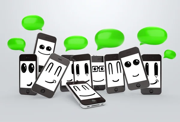 Teléfonos emoticonos con burbujas de habla —  Fotos de Stock