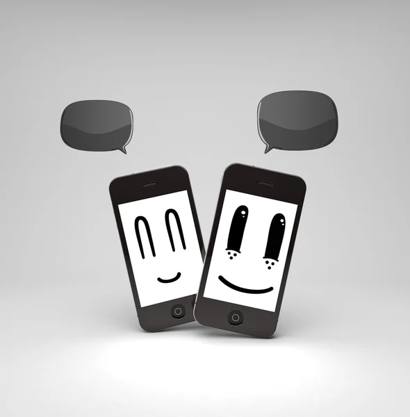 Два телефона смайлики — стоковое фото