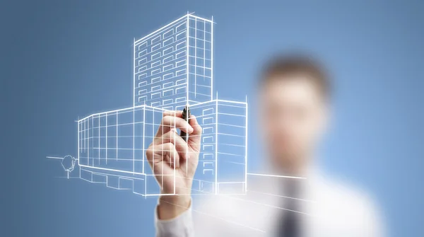 Man drawing skyscrapers — Stock Photo, Image