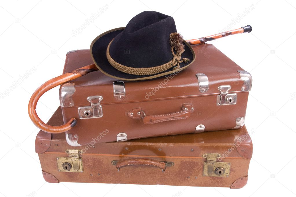 Vintage suitcases with walking stick and hat