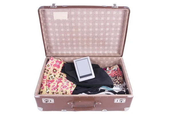 Vintage Suitcase with clothing and modern ebook — Stock Photo, Image