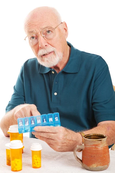 Senior vergaß Medikamente einzunehmen — Stockfoto