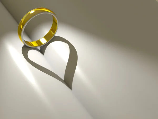 Anel de casamento lançando um coração — Fotografia de Stock