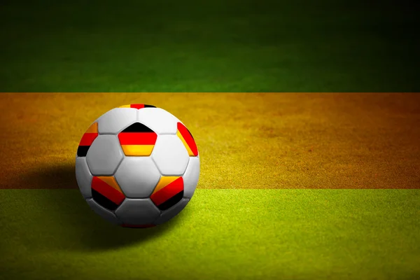Флаг Германии с футбольным мячом на травяном фоне - 20 евро — стоковое фото