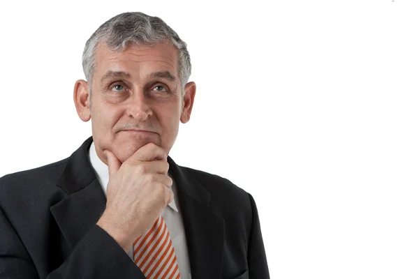 Portrait of a senior business man thinking something — Stock fotografie