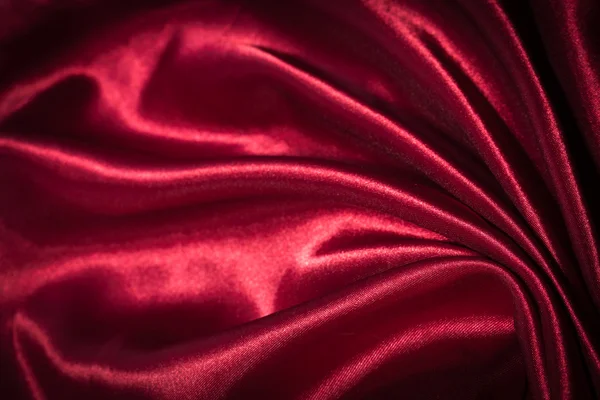 Червоний шовковий текстильний фон — стокове фото