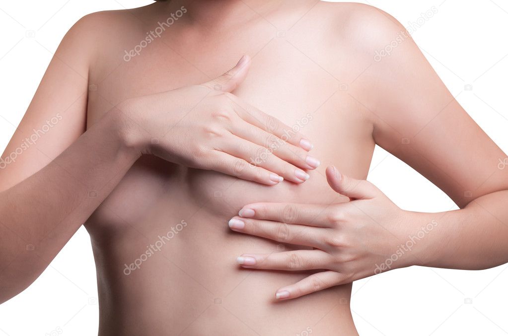 Young Asian adult woman examining her breast for lumps or signs