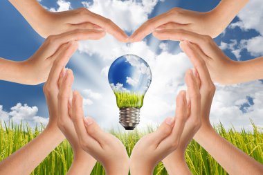 Hands saving , Global Concept of Green Energy Solutions With Lig clipart