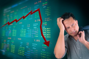 Business man stress about falling stock market