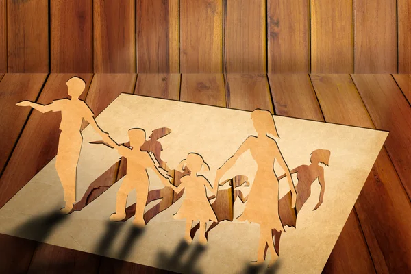 Warmth family concept, make for cut out of paper on wood texture — Stock Photo, Image