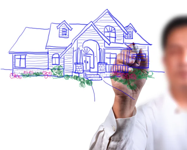 Männliche Hand zeichnet ein schönes Haus — Stockfoto