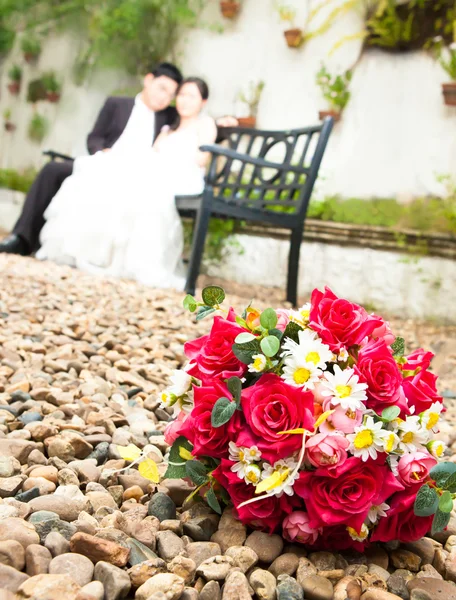 Flowers with bride and groom