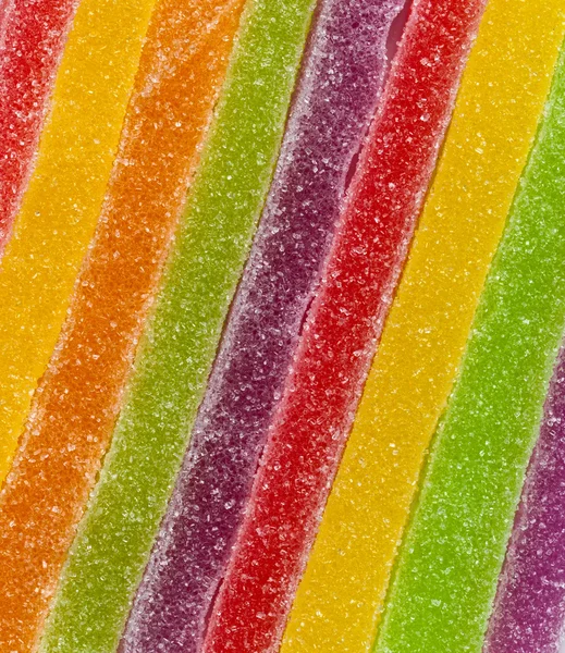 Zbliżenie: taśmy kolorowe cukierki — Zdjęcie stockowe