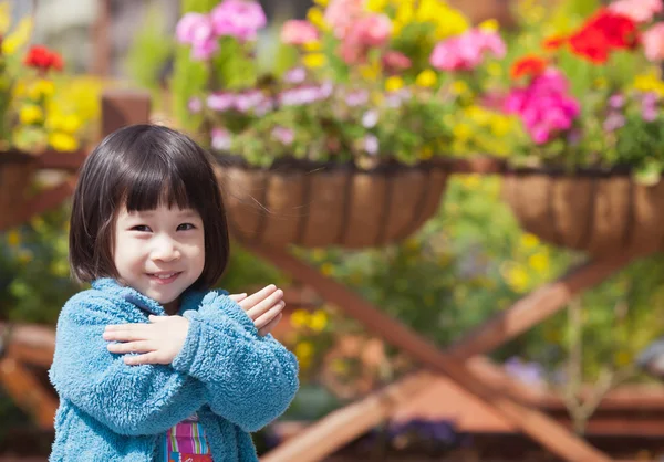 stock image Cute asian girl with spring flowers