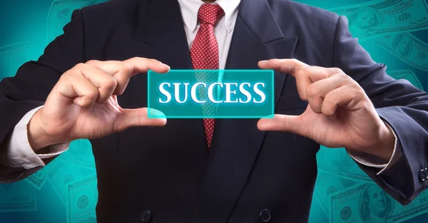 Business man holding button of success — Stock Photo, Image