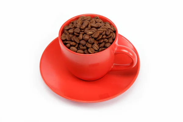 Kopp med bönor kaffe på fat — Stockfoto