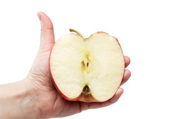 白い背景にリンゴの半分を持つ女性の手 — ストック写真
