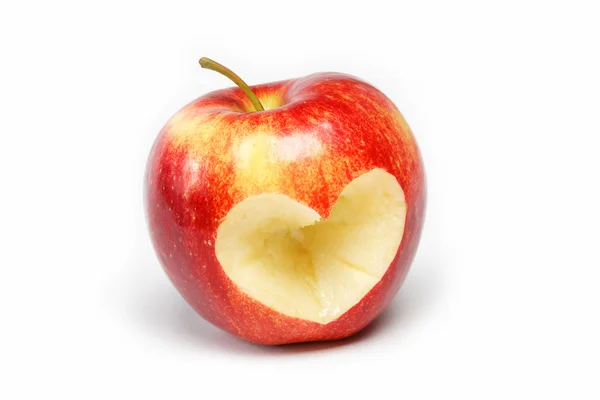 Red apple with a heart symbol against white background — Stock Photo, Image
