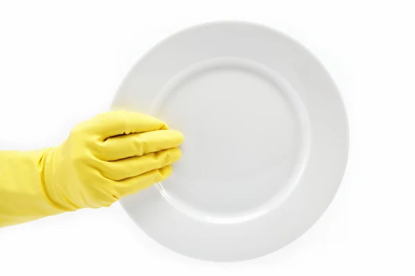Mano in guanto di gomma con un piatto su sfondo bianco . — Foto Stock