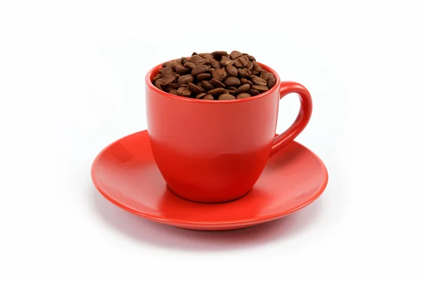 Taza con café frijoles en platillo —  Fotos de Stock