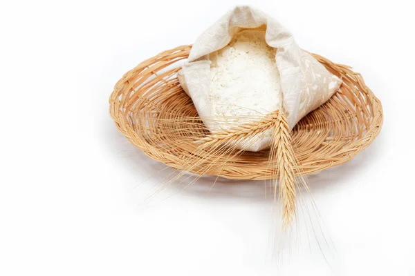 stock image Flour and wheat grain on a wicker basket.