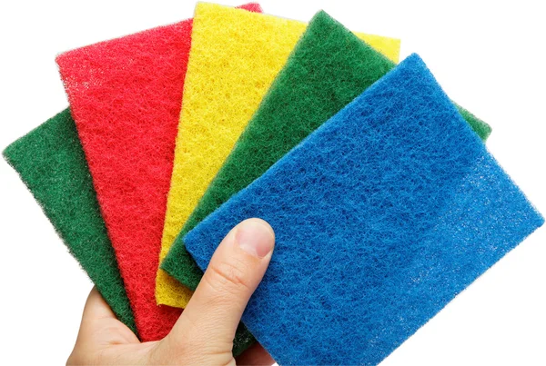 Female hand with colorful cleaning sponges, isolated on a white — Stock Photo, Image