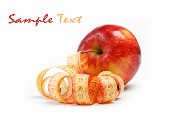 Piros alma és egy fehér háttér mérőszalag. — Stock Fotó