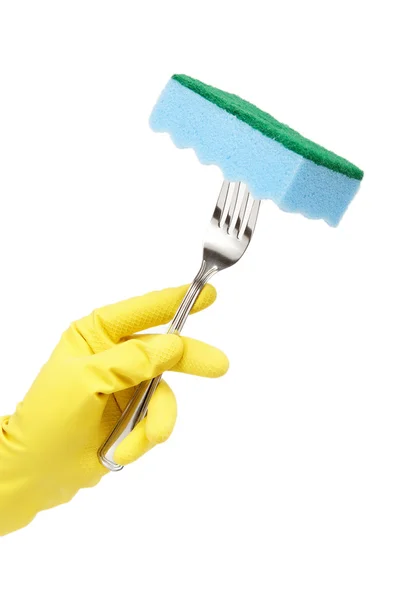 Mão na luva de borracha que segura uma esponja em um garfo sobre o backg branco — Fotografia de Stock