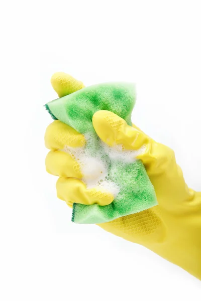 Un guanto di pulizia giallo con una spugna su uno sfondo bianco — Foto Stock