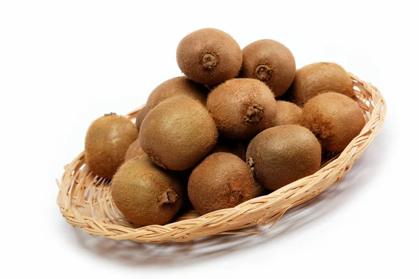 Fresh fruit. Kiwi in basket isolated on a white background. — Stock Photo, Image