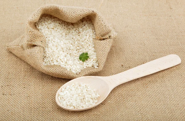 Rice in a bag on sacking. — Stock Photo, Image