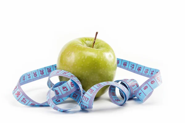 Produkty naturalne. dieta. świeże jabłka z taśmy pomiarowe na w — Zdjęcie stockowe
