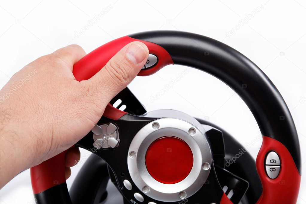 The hand on the steering wheel computer game consoles, isolated