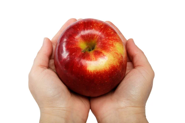 Frauenhand mit einem Apfel auf weißem Hintergrund — Stockfoto