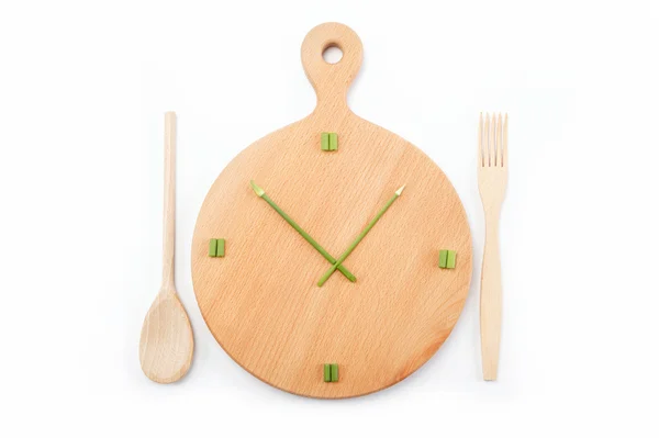 stock image Lunch time. Cutting board laid out as a clock.