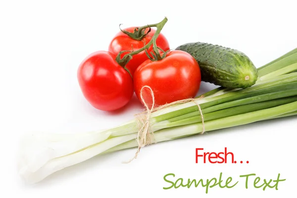 Fresh green onions, cucumber and tomato isolated on white. — Stock Photo, Image