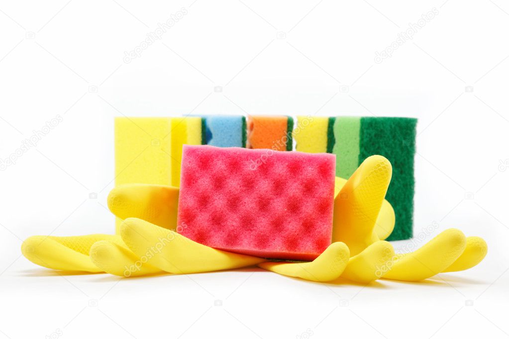 Rubber gloves and a cleaning sponges on a white background.