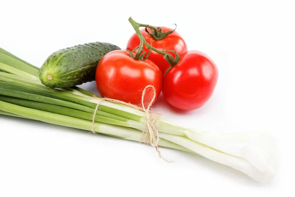 stock image Fresh green onions, cucumber and tomato isolated on white.