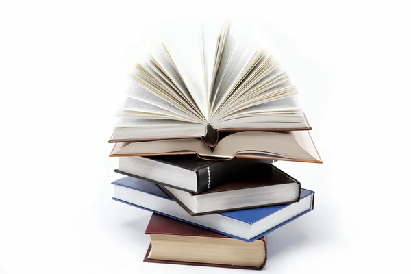 A stack of books on a white background. Open book. — Stock Photo, Image