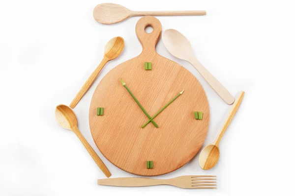 stock image Lunch time. Meals. Watches are made of green onions on a wooden