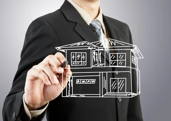 Businessman hand drawing house — Stock Photo, Image