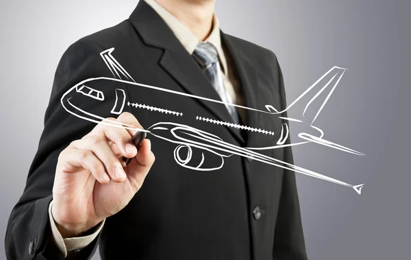 Homem de negócios desenhar transporte de avião — Fotografia de Stock
