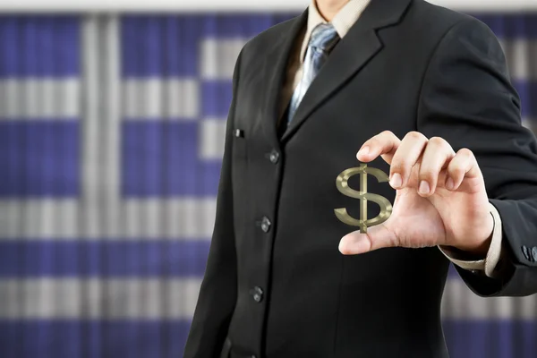 Dollar symbol in businessman hand on greece flag background — Stock Photo, Image