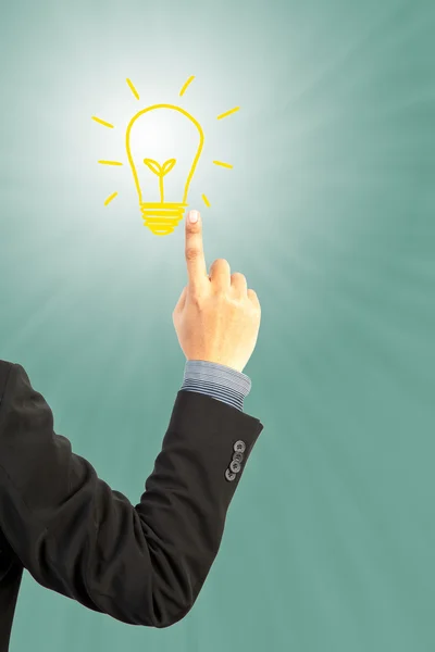 Business man hand pushing light bulb idea — стоковое фото