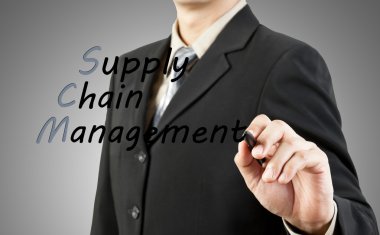 Businessman write the word supply chain management clipart