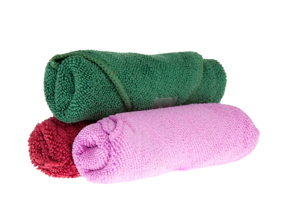 Colorful towels rolls on white background Stock Photo