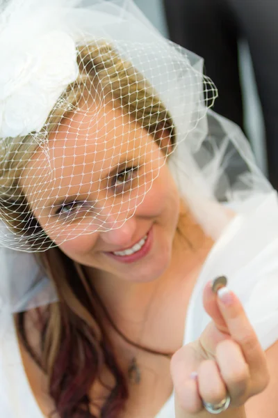 stock image The bride find a lucky coin