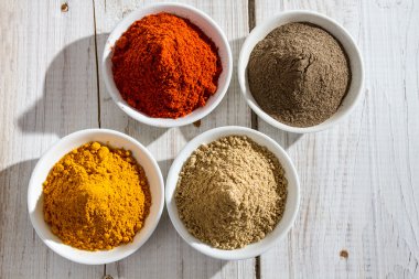 Close-up of four types of spices clipart