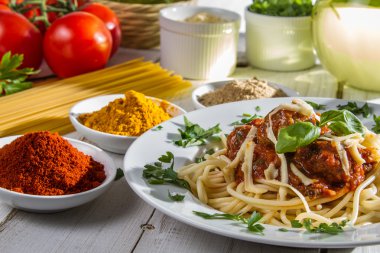 Close-up of spaghetti served with spices clipart